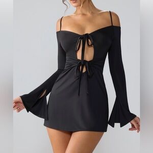 Slinky jersey long sleeve cut out mini dress